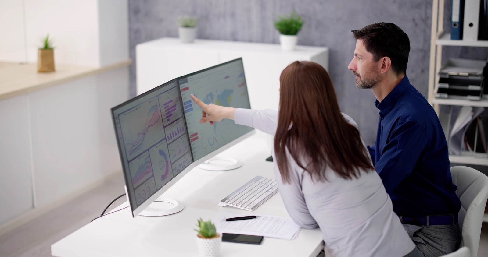 data-integration-2-people-looking-screen.jpg